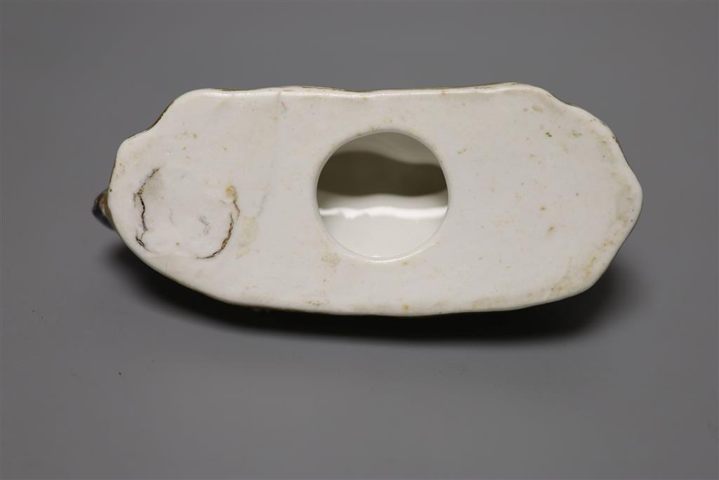 An English porcelain figure of resting dog, c.1830-50, width 13cm